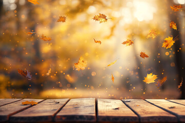 Wall Mural - wooden table with an autumn background and blurred golden-yellow bokeh light, with falling leaves in