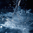 © Aliona Ryne - Close-up of splashing water on dark background.
