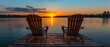 © COK House - Tranquil scene: two wooden chairs on dock facing calm lake at sunset. Yellow, orange, white sky reflects on water with trees and mountains in background.