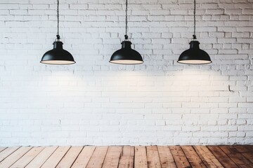 Three Black Pendant Lights Hanging Over White Brick Wall and Wooden Floor