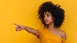 © Evalva786 - Woman Pointing Finger Aside, Isolated over Yellow Background, Gesturing Concept