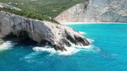 Sticker - Aerial view of waves hitting the rocky shores of Porto Katsiki beach on the Greek island of Lefkada