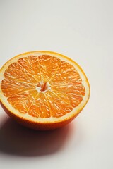 Aufkleber - Fresh orange cut in half on a clean white surface