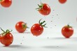 © Fotograf - A cluster of ripe tomatoes suspended in mid-air, ideal for use as a creative prop or visual representation