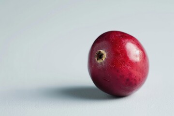 Aufkleber - A bright red apple sits atop a clean and simple white background, ideal for use in food or still life photography