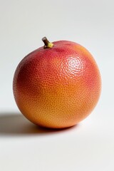 Poster - A detailed view of a grapefruit sitting on a white surface