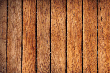 Closeup of natural wood grain texture with a warm brown color.