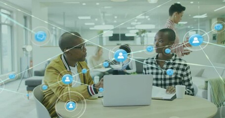 Poster - Animation of network of connections with icons over diverse colleagues using laptop in office