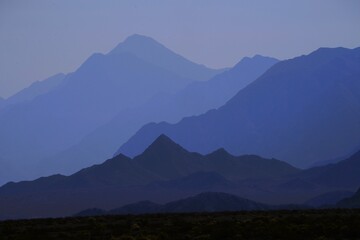 Canvas Print - Serene view of Layers of Blue: Enchanting Mountain Ranges