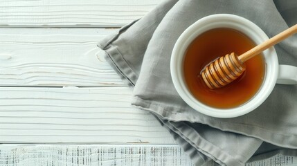 Wall Mural - a bowl with honey and a wooden spoon 