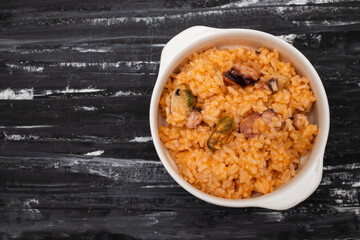 Wall Mural - traditional portuguese dish rice with seafood in white dish