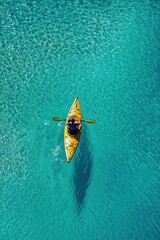 Wall Mural - Aerial view of kayak boat in tropical sea water