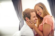 © AK Coop/peopleimages.com - Love, laughing and hug with couple in bedroom for romance, bonding and marriage. Honeymoon, getaway and house rental with man and woman on holiday or staycation for anniversary retreat and mockup