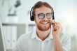 © peopleimages.com - Call center, man and agent with headset talking to client for customer service, technical support and advice. Telemarketing, friendly consultant and help desk operator with microphone for assistance