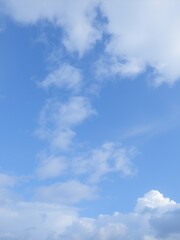 Canvas Print - A bright blue sky with wispy white clouds.