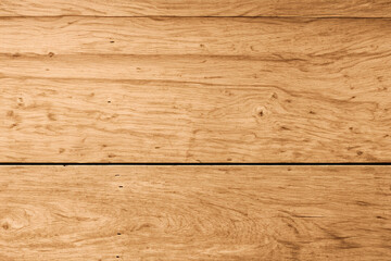 Close-up of a light brown wood grain texture with a horizontal line dividing the image.