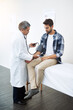 © TamJam/peopleimages.com - Men, doctor and patient with sphygmomanometer for checkup, consultation and healthcare at hospital. People, stethoscope and clinic for exam, checkup and support with help for high blood and pulse