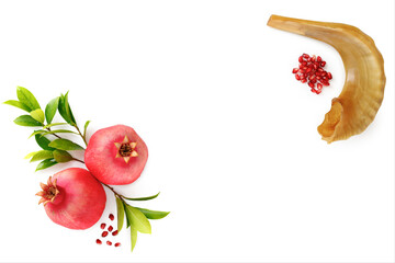 Pomegranates and shofar symbol of the Jewish holiday-Rosh Hashanah white background. Top view