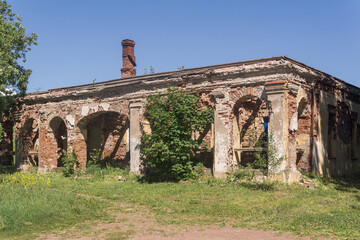 abandoned ruins of an ancient building among the grass