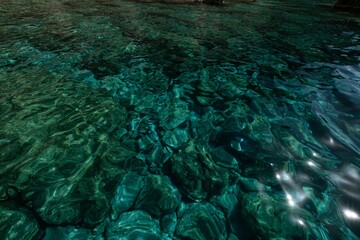 Wall Mural - Beautiful turquoise water in the sunlight creating intricate patterns in Zakynthos Island, Greece