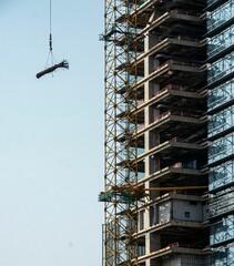 Wall Mural - High-rise building under construction with crane