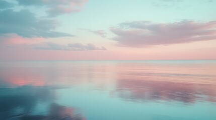 Wall Mural - A quiet beach scene at twilight, soft pinks and blues reflecting in the calm waters.