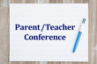 © Karen Roach - Parent Teacher conference with retro lined school paper with pen on wood