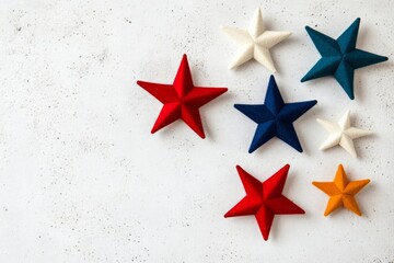 Vibrant Felt Star Arrangement on Textured Surface - Red, Blue, White, and Gold Decorative Stars