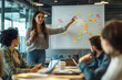 © SejutaCahaya - A young woman is leading a business meeting, giving a presentation on a whiteboard with sticky notes and charts.