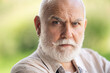 © Volodymyr - Old man with Grey hair and white beard. Bearded Senior man. Face of bearded senior age man. Headshot of bald pensioner, retiree concept. Closeup portrait of an old mature senior man with grey beard.