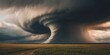 © Ta Sher - Dramatic tornado cloud swirling ominously over a vast countryside field.