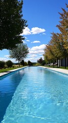 Poster - Tranquil Lap Pool with Blue Sky and Trees.