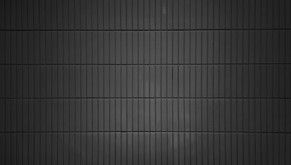 close up image of dark black ceramic clay wall tiles use as background with blank space for design. interior wall finishing material. metro tiles background. subway brick in vertical pattern.