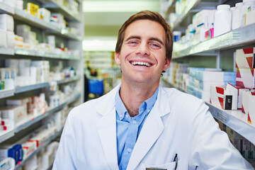 Poster - Man, pharmacist portrait and happy at dispensary, employee and confident chemist at drugstore. Male person, pharmacy and proud of medication treatment at apothecary, service and laughing in England