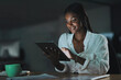 © peopleimages.com - Night, tablet and planning with business woman in office for network, communication or administration. Auditor, processing clerk and online report with person in agency for system record and feedback