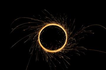 Circular lights with sparks on a black background