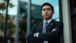 © raja - Confident Businessman Standing Outside Office Building