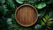 © Jirut - Empty circular wooden frame surrounded by tropical leaves against a lush jungle background