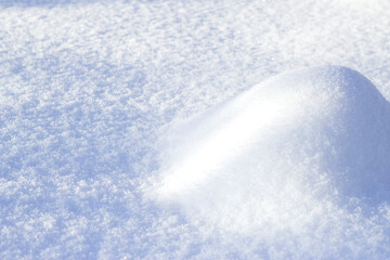 snow drift on sunny snow surface 