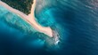 © TheseusAiStock - A striking aerial stock photo of a tropical island chain with each island connected by a thin strip of sand.