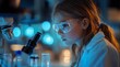 © atar - Female scientist looking through a microscope in a lab