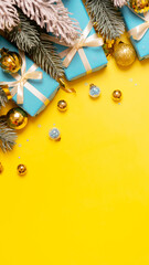 Wall Mural - christmas vertical yellow-blue background with pine tree, gifts and festive decorations