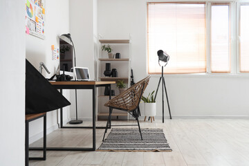 Wall Mural - Table with modern computer, photo camera and laptop in office. Photographer workplace concept