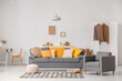 © Pixel-Shot - Autumn interior of living room with comfortable sofa and armchair