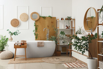 Canvas Print - Interior of beautiful bathroom with chest of drawers, bathtub, houseplant and shelving unit