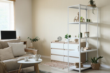 Sticker - Interior of living room with shelving unit, sofa, coffee table and chest of drawers