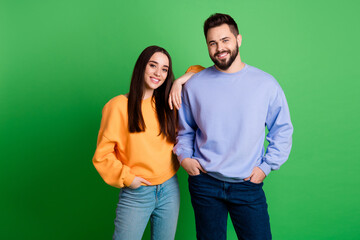 Sticker - Photo of happy positive couple people wear stylish clothes isolated on green color background