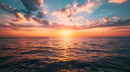 Wall Mural - horizon sea sky background sunset sky clouds over sea in the evening with orange yellow sunlight gol