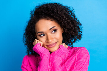 Wall Mural - Photo portrait of attractive young girl look dreamy empty space enjoy warmth dressed stylish pink clothes isolated on blue color background