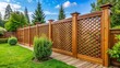 © Caitlin - A decorative fence with latticework details surrounding a wooden border creates a peaceful and secluded atmosphere for